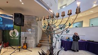 A menorah crafted from the remains of an Iranian missile stands at the heart of ALEH’s renovated campus in Bnei Brak, Dec. 15, 2025 