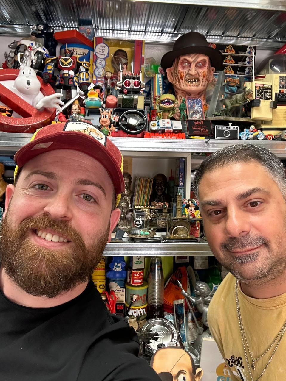 Gindy (left) and Vital (right) pose in front of shelves packed with vintage Israeli toys, advertising figures and memorabilia (Photo: Bar Gindy) Gindy (left) and Vital (right) pose in front of shelves packed with vintage Israeli toys, advertising figures and memorabilia