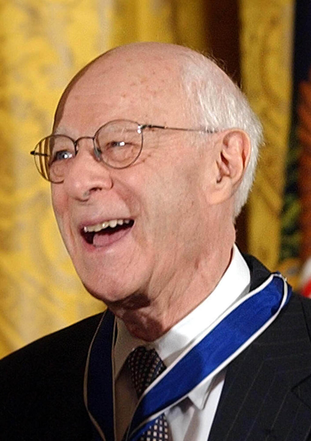 Norman Podhoretz receives the Presidential Medal of Freedom, the nation's highest civil award, from President Bush during a ceremony in the East Room of the White House, June 23, 2004