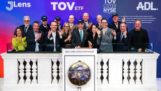 Members of JLens, the Anti-Defamation League and invited guests pose at the New York Stock Exchange podium after ringing the closing bell, Wednesday, Dec. 17, 2025, in celebration of the TOV ETF’s launch 