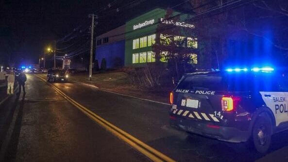 Police on scene at the Extra Space Storage facility where the Brown University shooting suspect was found dead 