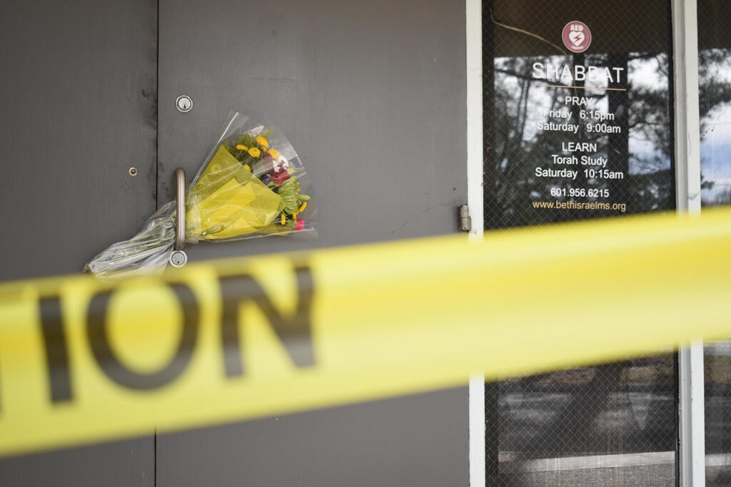 Caution tape and flowers cover the entrance to the Beth Israel Congregation, a synagogue that was set on fire early Saturday morning, on Monday, Jan. 12, 2026, in Jackson, Miss (Photo: AP Photo/Sophie Bates) Caution tape and flowers cover the entrance to the Beth Israel Congregation, a synagogue that was set on fire early Saturday morning, on Monday, Jan. 12, 2026, in Jackson, Miss