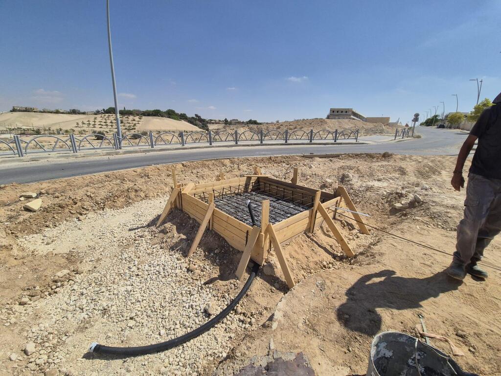 Early construction phase of the Yeruham light installation, with foundation work underway at one of the city’s roundabouts 