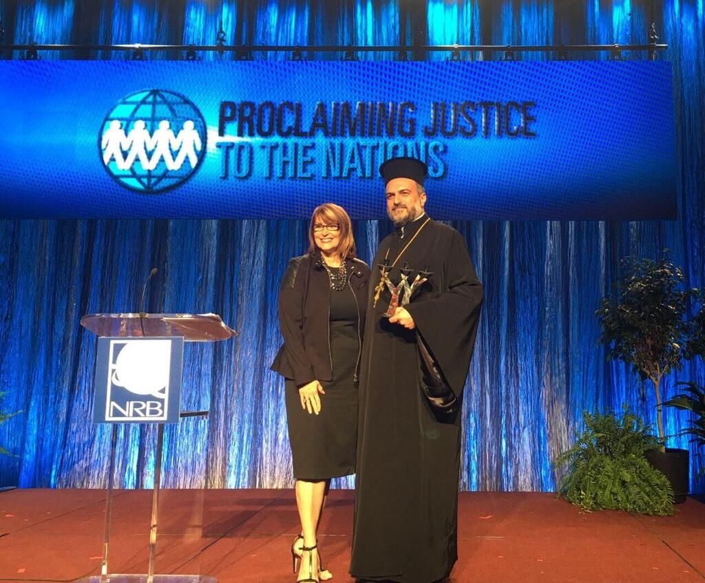Laurie Cardoza Moore with Israeli priest Father Gabriel Naddaf 