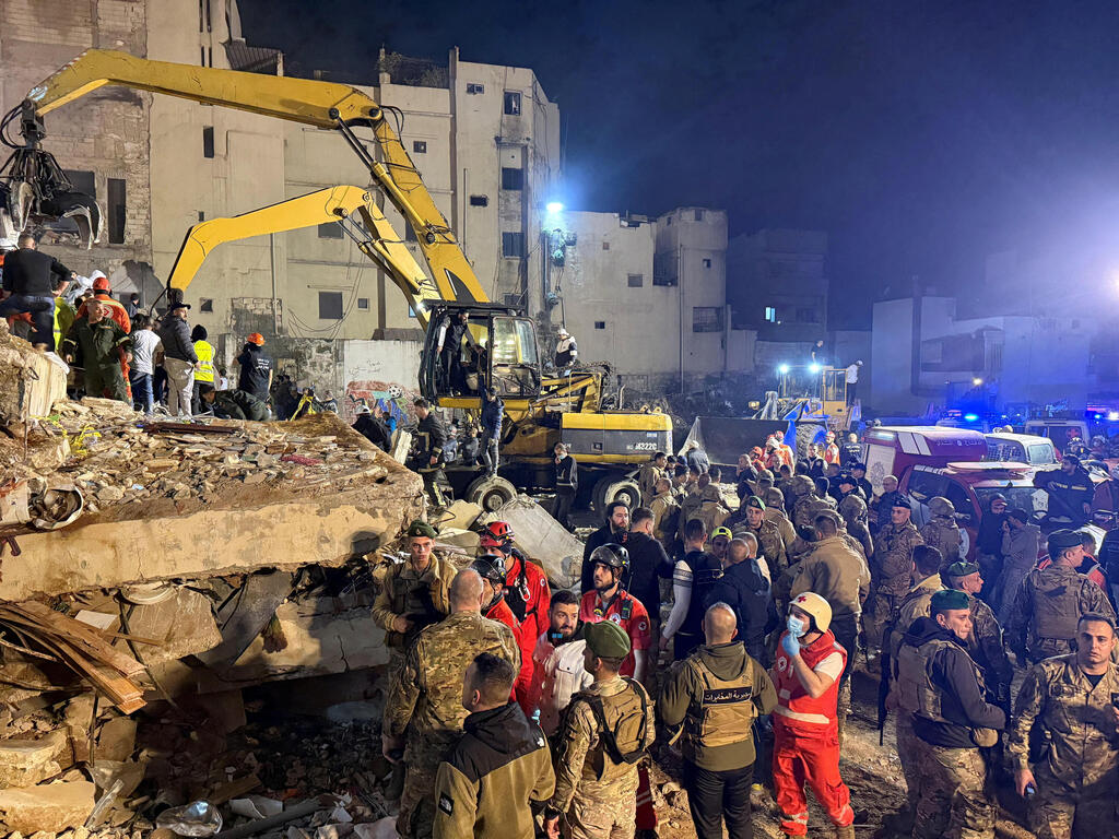 Rescue teams search for survivors after a building collapsed in Tripoli, Lebanon, February 8, 2026 