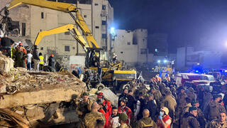 Rescue teams search for survivors after a building collapsed in Tripoli, Lebanon, February 8, 2026 