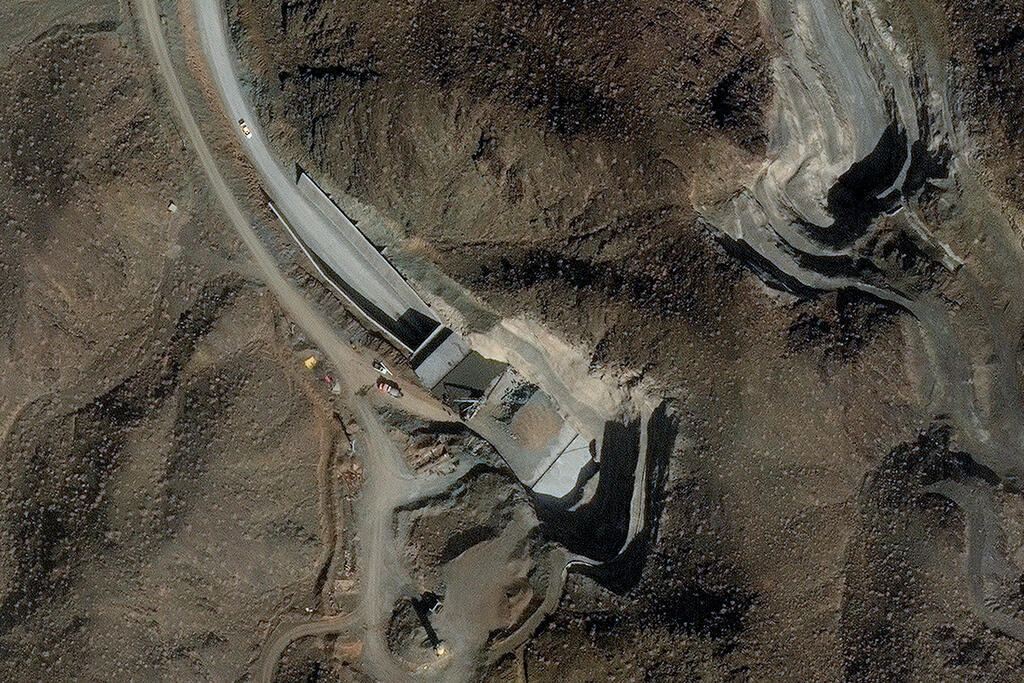 A satellite image shows ongoing efforts to harden and strengthen a facility's two tunnel entrances at a complex near Nantanz, Iran, February 10, 2026 