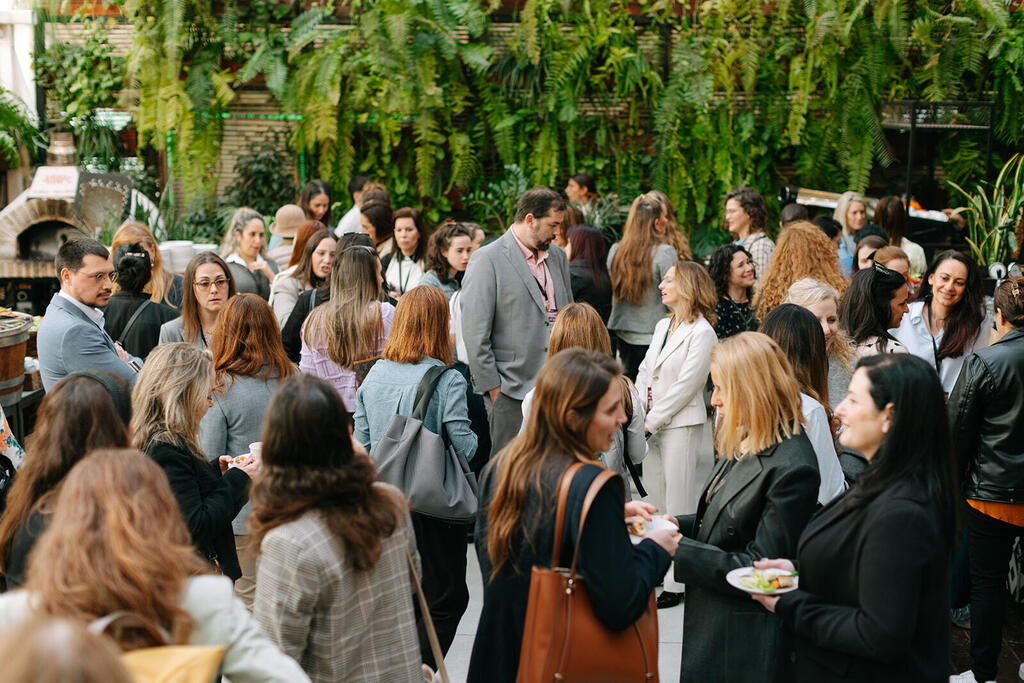 Attendees network during the Women Shaping the Future of Business, Tech & IP event in Tel Aviv 
