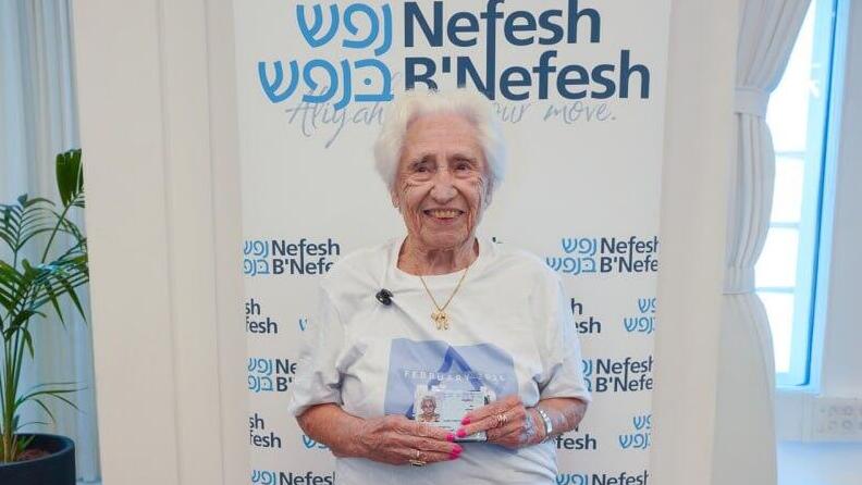 Charlotte Roth holding her Israeli ID 