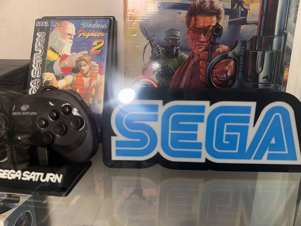 A Sega Saturn console and controller are displayed alongside retro gaming memorabilia in Or’s gaming room in Hadera (Photo: Bar Gindy) A Sega Saturn console and controller are displayed alongside retro gaming memorabilia in Or’s gaming room in Hadera