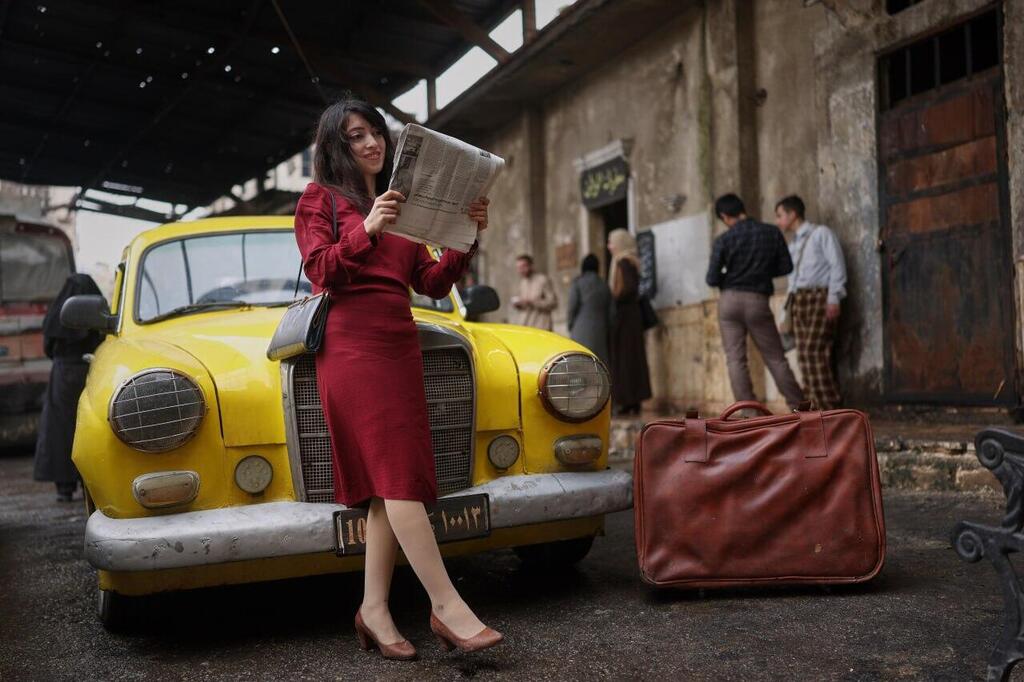 Rita Nasra, an extra in the series, poses for a photograph during the filming of an episode of the TV series 'Al-Souriyoun al-Aada' ('The Syrian Enemies')