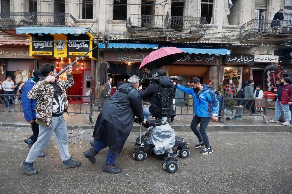 Television crew films an episode of the TV series 'Al-Souriyoun al-Aada' ('The Syrian Enemies"), based on a novel that was banned under Bashar Assad, along a transformed street in central Aleppo, Syria 