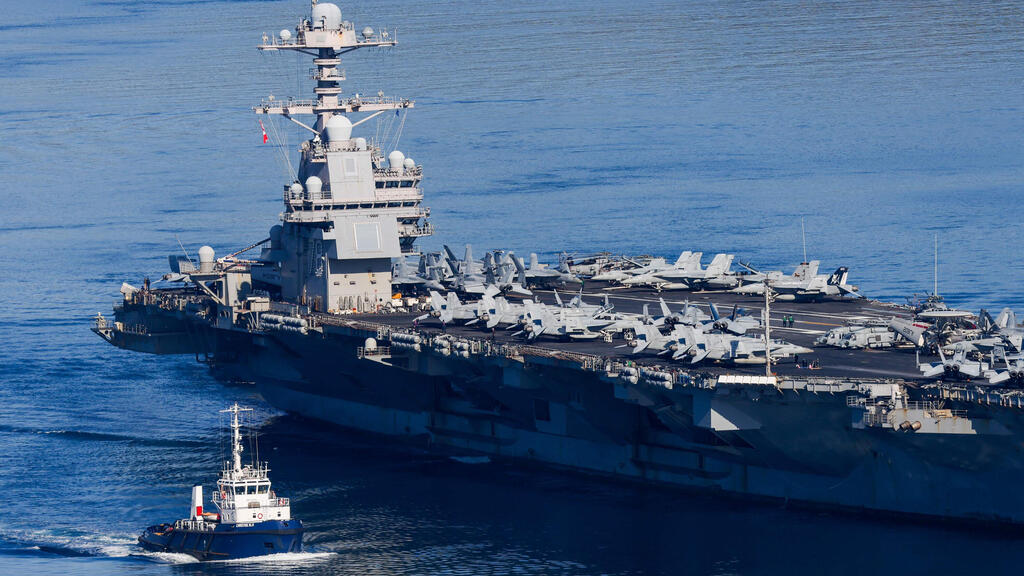 USS Gerald Ford aircraft carrier (Photo: Costas METAXAKIS / AFP) נושאת המטוסים ג'רלד פורד