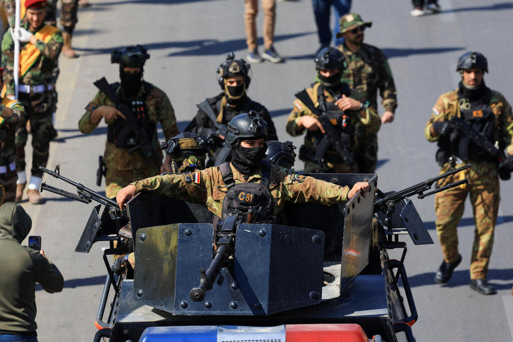 A military parade of Katai'b Hezbollah, a powerful pre-Iranian militia in Iraq (Photo: REUTERS/Thaier Al-Suda) גדודי חיזבאללה, מיליציה פרו איראנית בעיראק