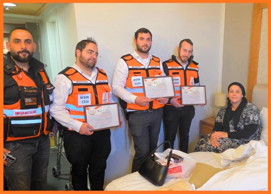 Volunteers Michael Kibudi, Moishy Shechter and Menachem Wizman, members of United Hatzalah’s specialized rescue unit, meet Pnina Cohen, who they cared for after the attack