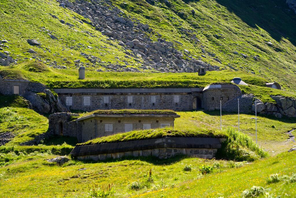 Artillery bunker fortification surrounded by meadow at Swiss mountain pass St. Gotthard 