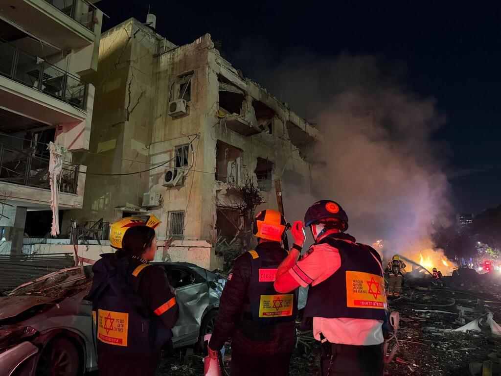 Magen David Adom responds after a Tel Aviv building is hit by an Iranian rocket  