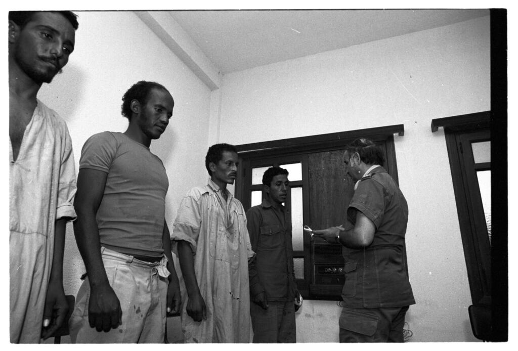 Moroccan soldiers interrogate captured Polisario fighters in the Sahara on Nov. 9, 1979 
