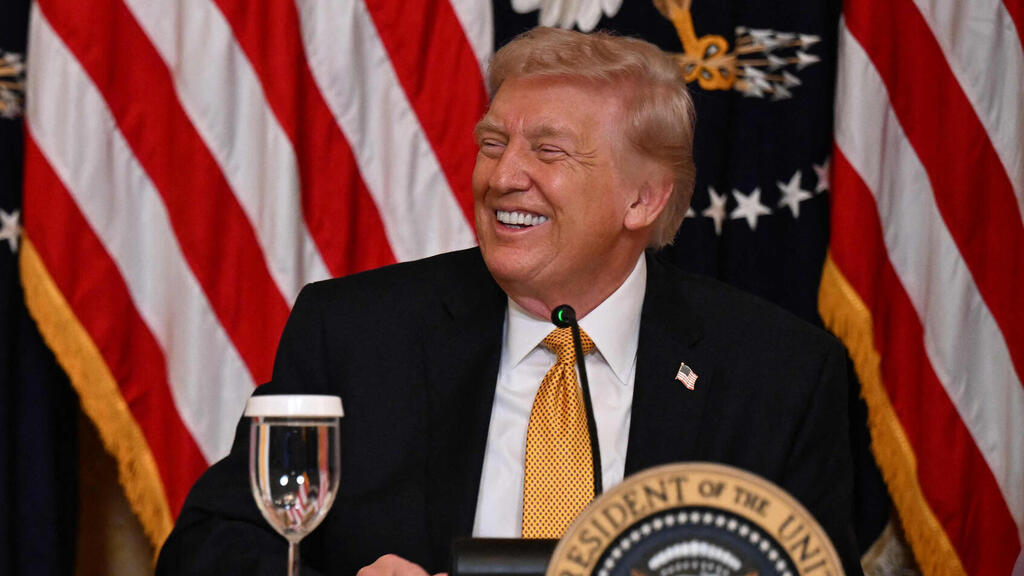 US President Donald Trump speaks to reporters at a White House event (Photo: Annabelle Gordon / AFP) דונלד טראמפ