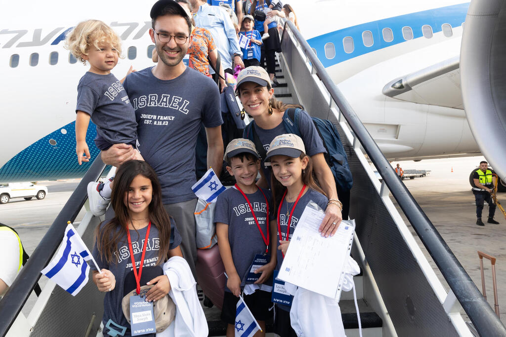 Aliyah is a choice rooted in identity, family, faith and a desire to take part in Israel’s future (Photo: Nefesh B’Nefesh) Olim taking their fist steps off their aliyah flight to Israel