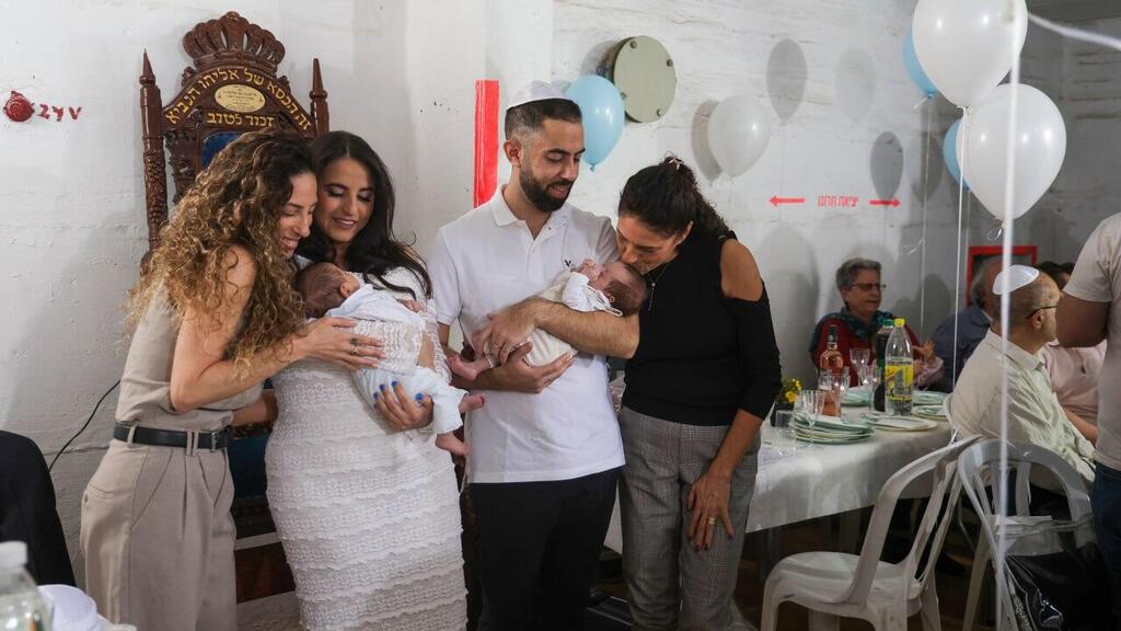 The new parents with their sons in the shelte (Photo: Avigail Uzi) The new parents with their sons in the shelte