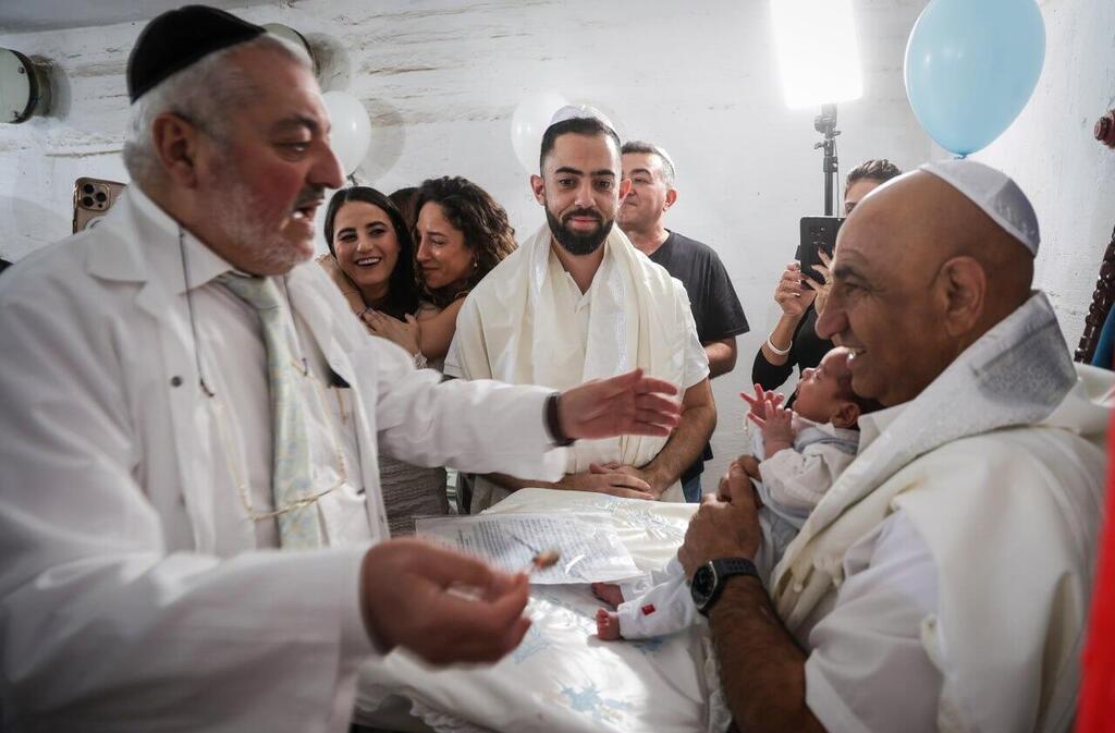 'Not the big event we imagined': Brit milah of the twins at the shelter in Holon (Photo: Avigail Uzi) 'Not the big event we imagined': Brit milah of the twins at the shelter in Holon