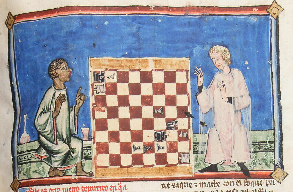A dark-skinned chess player is poised to defeat a fair-skinned clergyman. From the manuscript commissioned by King Alfonso X of Castile (Photo: Patrimonio Nacional. Real Biblioteca del Monasterio de El Escorial) שחמטאי כהה עור עומד לנצח מול איש דת בהיר עור. מתוך כתב היד שהוזמן על ידי אלפונסו העשירי, מלך קסטיליה