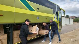 Eshkol Regional Council personnel load buses with equipment for Dimona and Arad