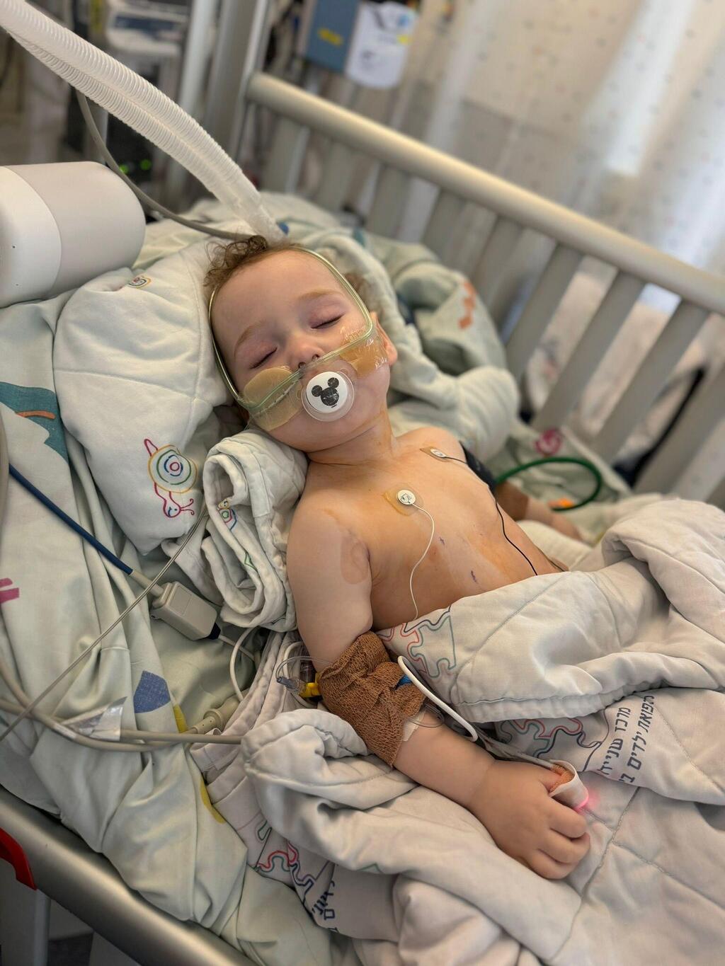 AJ lies in a hospital bed after emergency surgery (Photo: Courtesy) AJ lies in a hospital bed after emergency surgery to remove part of a rare brainstem tumor discovered after he collapsed at a playground