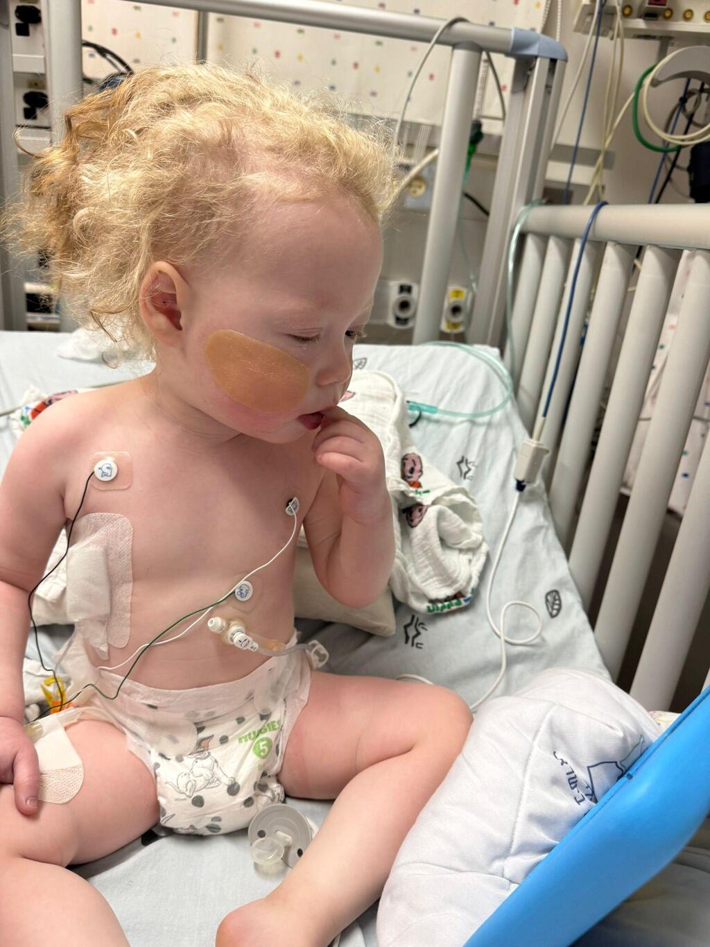 AJ sits up in his hospital bed during treatment and recovery from a rare brain tumor that doctors discovered after a respiratory arrest (Photo: Courtesy) AJ sits up in his hospital bed during treatment and recovery from a rare brain tumor that doctors discovered after a respiratory arrest