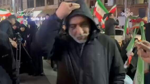 שר החוץ האיראני עראקצ׳י בהפגנה בטהרן