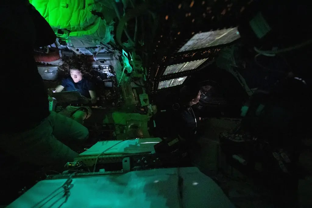 Inside the darkened Orion spacecraft 