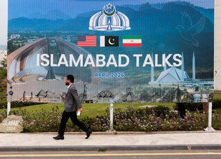Billboard near the media center as delegations from the United States and Iran begin peace talks in Islamabad, Pakistan, April 11, 2026