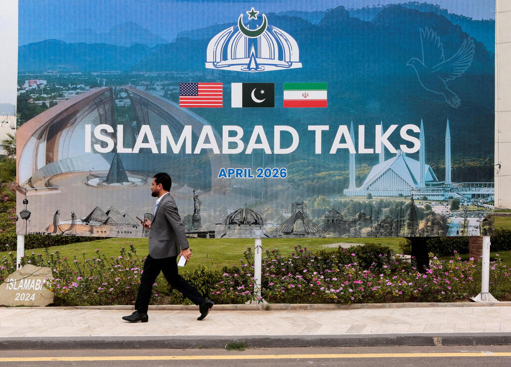 Billboard near the media center as delegations from the United States and Iran begin peace talks in Islamabad, Pakistan, April 11, 2026