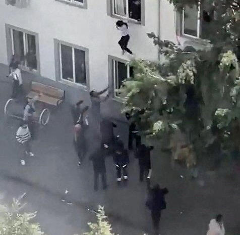 Students jump from classroom window to escape school shooting, in the southeastern province of Kahramanmaras, Turkey, April 15