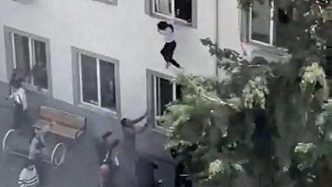 Students jump from classroom window to escape school shooting, in the southeastern province of Kahramanmaras, Turkey, April 15
