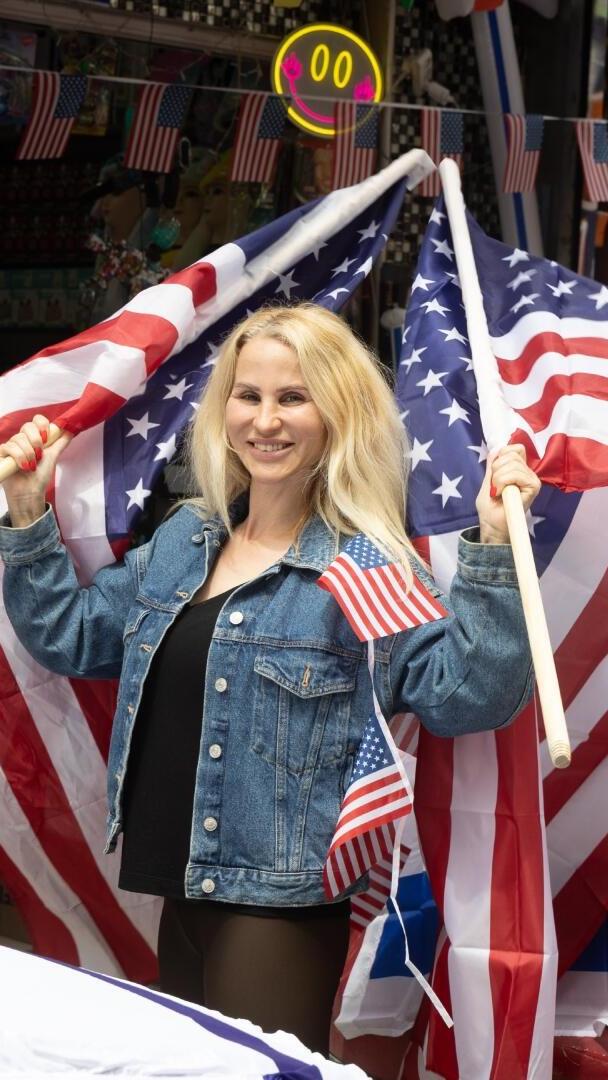 Ravit, Haim Bohadana's daughter, at the entrance to the family shop in south Tel Aviv