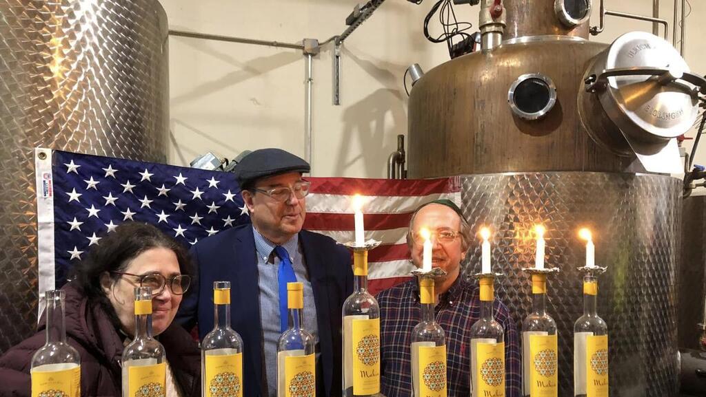  The Nahmias family at a Hanukkah event at their distillery