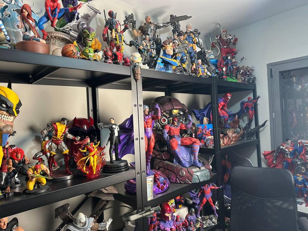 Shelves filled with superhero and sci-fi collectibles are seen in Eitan’s collection room at his home 