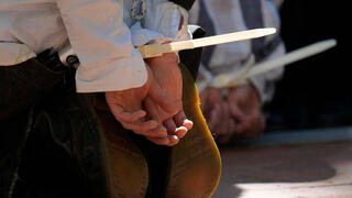 Protesters are cuffed after being detained on the campus of Emory University during a pro-Palestinian demonstration on April 25, 2024 