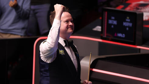 שון מרפי חוגג את הניצחון על ז'או שינטונג