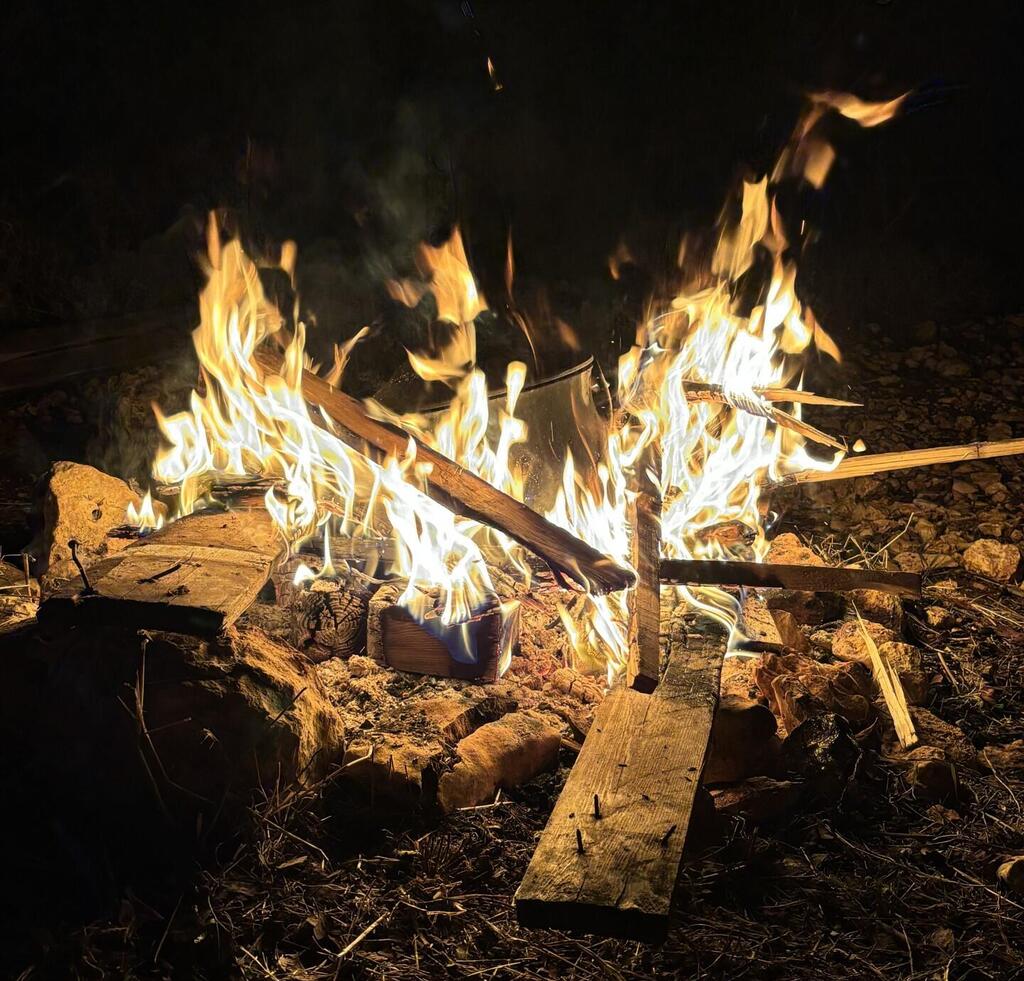 The bonfire becomes a metaphor for the spirit itself, which is called to reach toward something higher