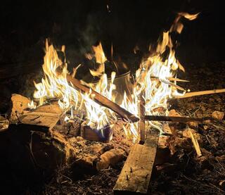The bonfire becomes a metaphor for the spirit itself, which is called to reach toward something higher