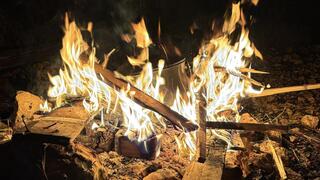 The bonfire becomes a metaphor for the spirit itself, which is called to reach toward something higher