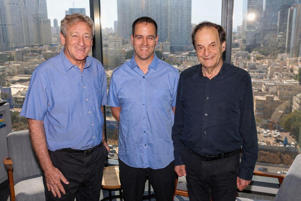 Former government minister Dan Meridor, right, and Professor Amitai Ziv, left, members of the award committee, with 2026 Charles Bronfman Prize winner Tomer Malchi 