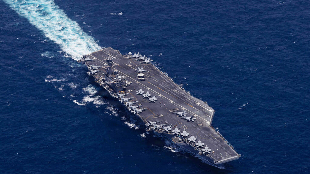 Potential threat: The aircraft carrier 'George Bush' (Photo: AFP / US Navy / Navcent Public Affairs) נושאת המטוסים האמריקנית "ג'ורג' בוש"