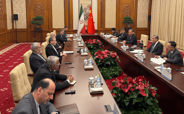 Iranian Foreign Minister Abbas Araqchi meets with Chinese Foreign Minister Wang Yi in a location given as Beijing, China, in this handout 