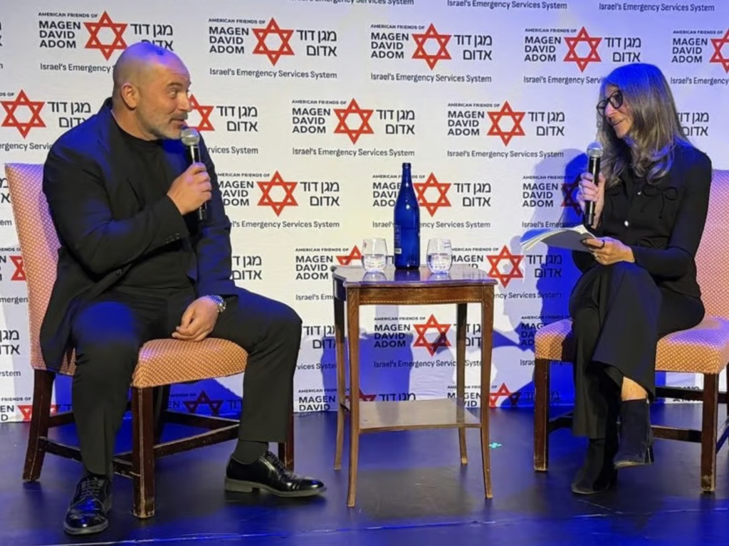 Lior Raz and Anita Greenwald in a live conversation on stage 
