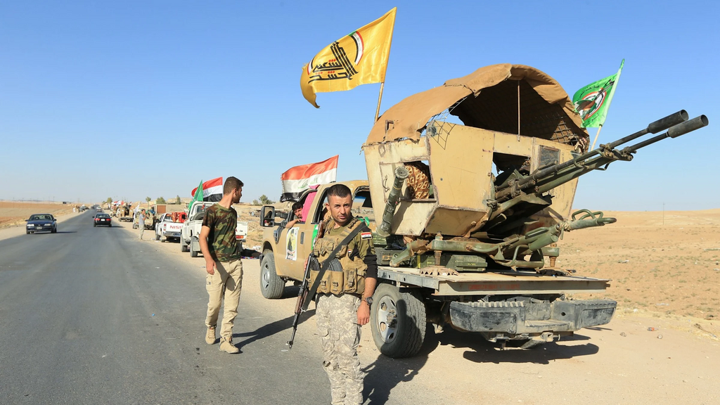 Hashd al-Shaabi members in Iraq (Photo: Reuters) חיילים ממיליציה פרו-איראנית מעיראק מפטרלים באיראן