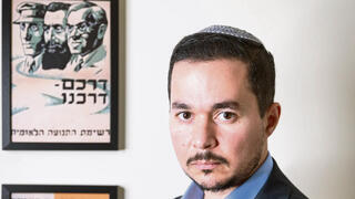 דן אילוז בלשכתו בכנסת, השבוע. "זה חוק שיש בו הרבה יותר חורים מאשר גבינה" | צילום: אלכס קולומויסקי